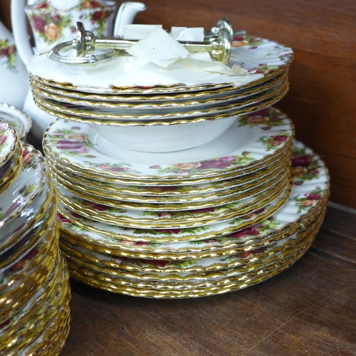 698 - Royal Albert Old Country Roses tea and dinnerwares, teapot, coffee pot, two cake stands, plates, bow... 