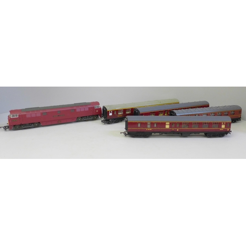 705 - An OO gauge Lima diesel Western Gladiator and four LMS maroon coaches