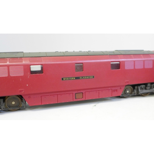 705 - An OO gauge Lima diesel Western Gladiator and four LMS maroon coaches