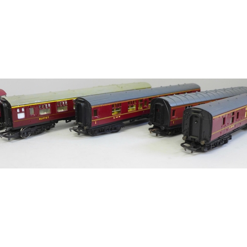 705 - An OO gauge Lima diesel Western Gladiator and four LMS maroon coaches