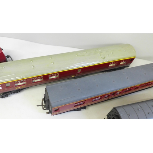 705 - An OO gauge Lima diesel Western Gladiator and four LMS maroon coaches