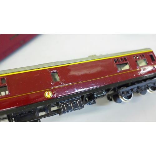 705 - An OO gauge Lima diesel Western Gladiator and four LMS maroon coaches