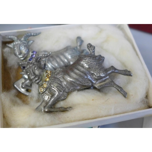 709 - A collection of costume jewellery in a box, including a silver RAF sweetheart brooch and a Danish si... 