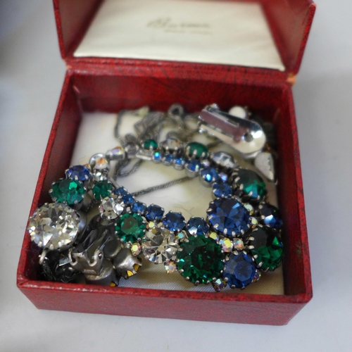 709 - A collection of costume jewellery in a box, including a silver RAF sweetheart brooch and a Danish si... 