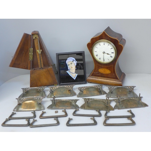 713 - An Edwardian inlaid mantle clock with key, a Maelzel metronome, a butterfly wing Art Deco style port... 