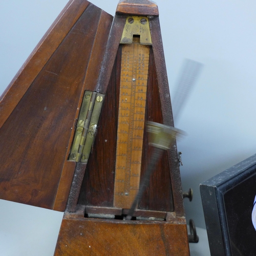 713 - An Edwardian inlaid mantle clock with key, a Maelzel metronome, a butterfly wing Art Deco style port... 