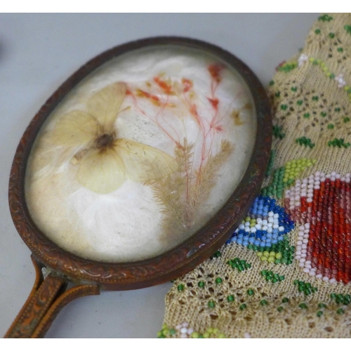 716 - Two fans, one made from an 1851 Mont Blanc page, a butterfly mirror and three beaded purses