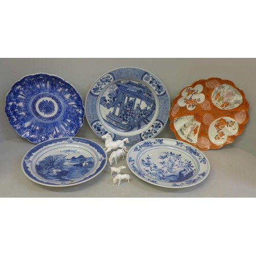 726 - Four Chinese export blue and white plates, a Kutani plate and four white china models of horses