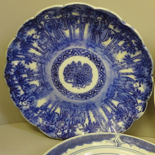 726 - Four Chinese export blue and white plates, a Kutani plate and four white china models of horses