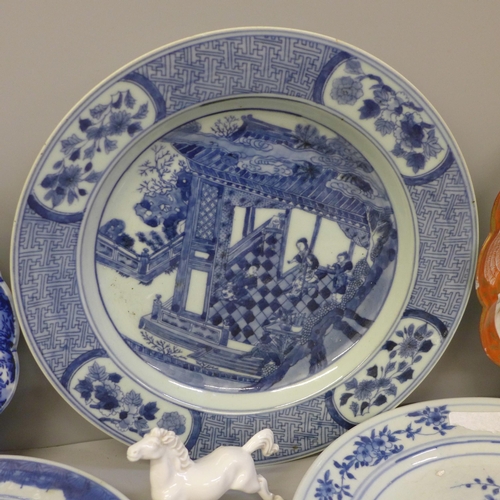 726 - Four Chinese export blue and white plates, a Kutani plate and four white china models of horses