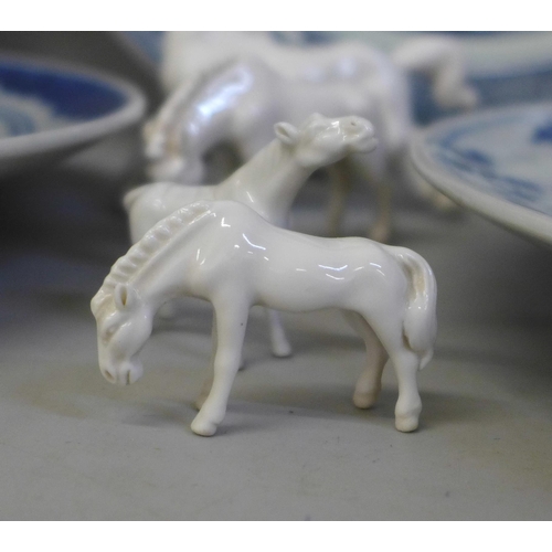 726 - Four Chinese export blue and white plates, a Kutani plate and four white china models of horses