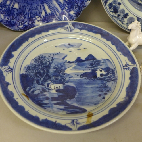 726 - Four Chinese export blue and white plates, a Kutani plate and four white china models of horses