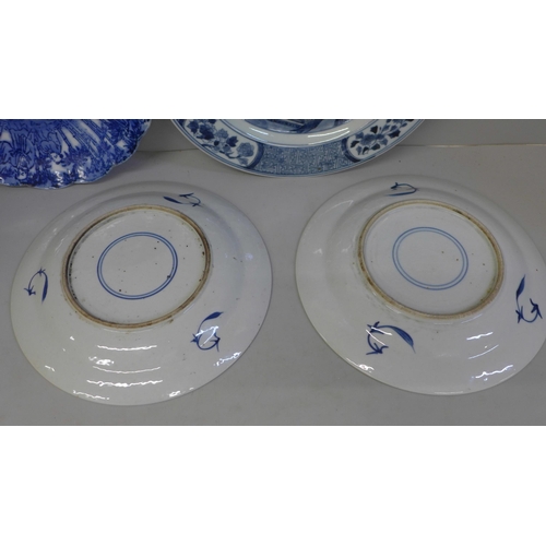 726 - Four Chinese export blue and white plates, a Kutani plate and four white china models of horses