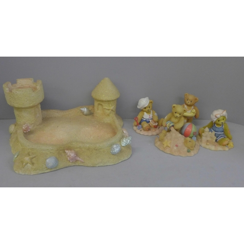 732 - A Cherished Teddies beach sandcastle display stand and four bears