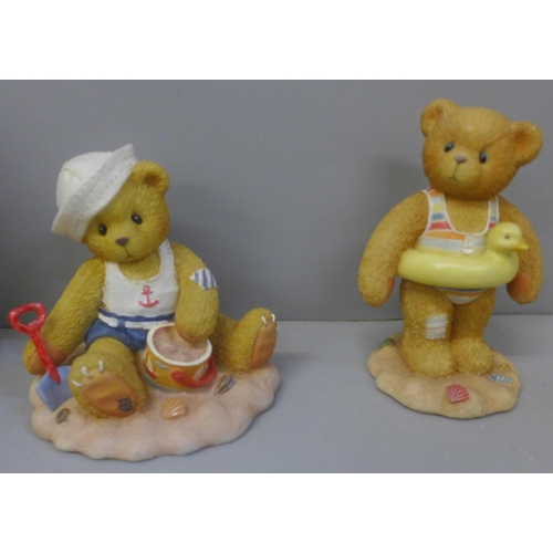 732 - A Cherished Teddies beach sandcastle display stand and four bears