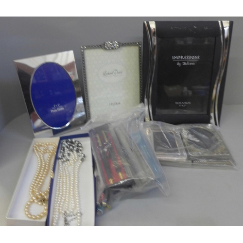 751 - Costume jewellery, a compact, six photograph frames, pens, etc.