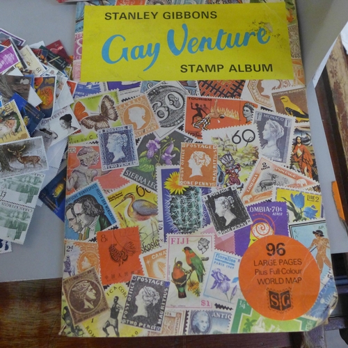 783 - A large quantity of loose stamps and a quantity of stamp albums