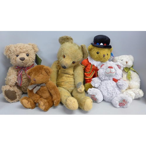 792 - A collection of Teddy bears including one vintage and two Harrods bears