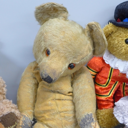 792 - A collection of Teddy bears including one vintage and two Harrods bears