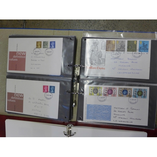 797 - A collection of first day covers in album, an empty stamp album and an album containing British and ... 