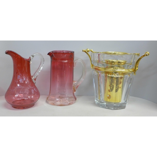 812 - A crystal ice bucket/wine cooler and two cranberry glass jugs **PLEASE NOTE THIS LOT IS NOT ELIGIBLE... 