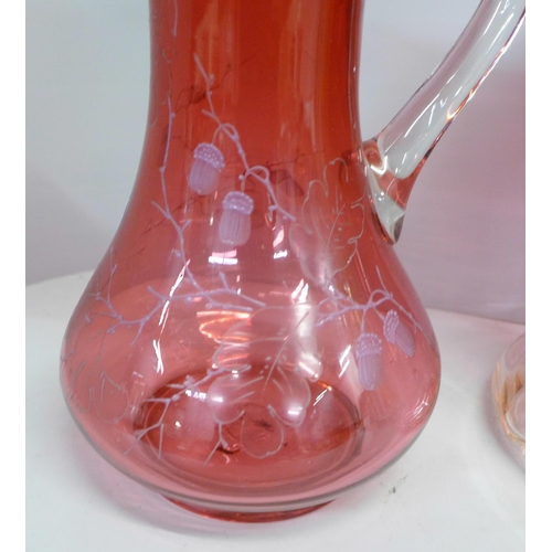 812 - A crystal ice bucket/wine cooler and two cranberry glass jugs **PLEASE NOTE THIS LOT IS NOT ELIGIBLE... 