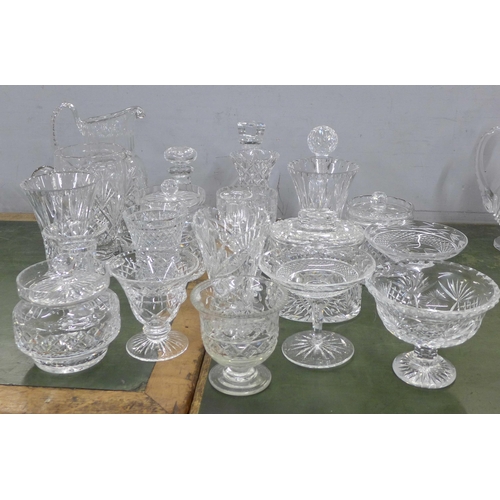 814 - A large collection of crystal and glass vases, sweeetmeat dishes, pitchers, jugs, etc., twenty-two i... 