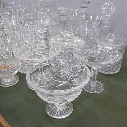 814 - A large collection of crystal and glass vases, sweeetmeat dishes, pitchers, jugs, etc., twenty-two i... 