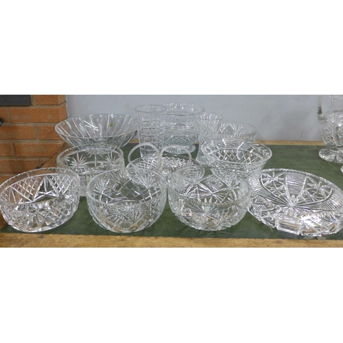 815 - A large collection of crystal and glass bowls, vases and a pair of baskets, fourteen in total **PLEA... 