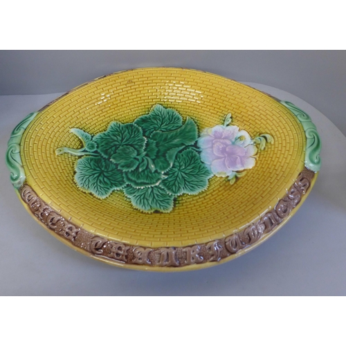 829 - A Victorian majolica bread plate, Adams & Bromley, geranium pattern, unmarked, and a Toby jug