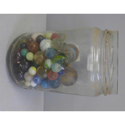 831 - A jar of vintage marbles