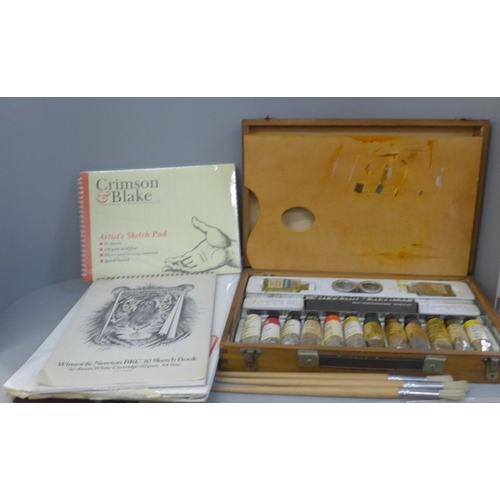 849 - A Rowney wooden artist's case with paints, palette, brushes and sketch pads