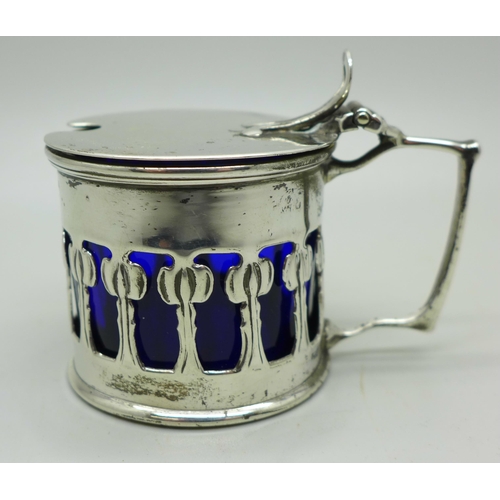 875 - An Art Nouveau design mustard, blue glass liner, 64g, Birmingham 1902