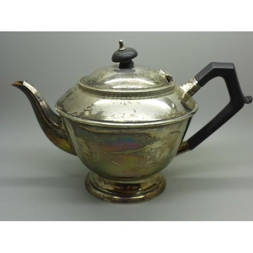 878 - A silver teapot, Birmingham 1932, dent to one area, 435g gross weight