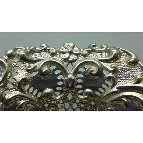 881 - An embossed pierced dish on four hoof feet, Birmingham 1901, 78g