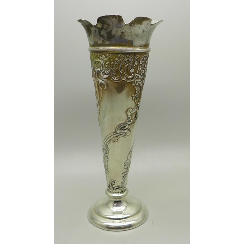 882 - An embossed silver vase, William Comyns, London 1902, heavily weighted base, gross weight 239g