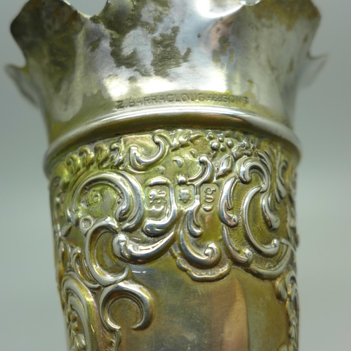 882 - An embossed silver vase, William Comyns, London 1902, heavily weighted base, gross weight 239g