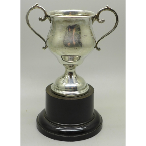 889 - A two handled silver trophy on stand, London 1937, 75mm tall, 39g