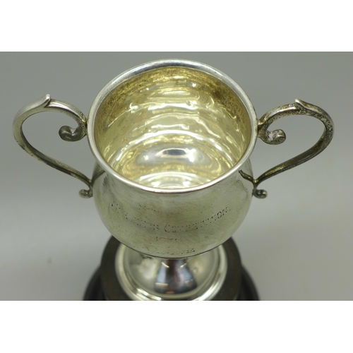 889 - A two handled silver trophy on stand, London 1937, 75mm tall, 39g