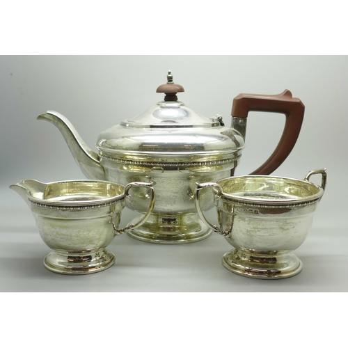 893 - A silver three piece tea service, Birmingham 1933, 614g