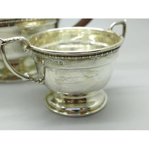 893 - A silver three piece tea service, Birmingham 1933, 614g