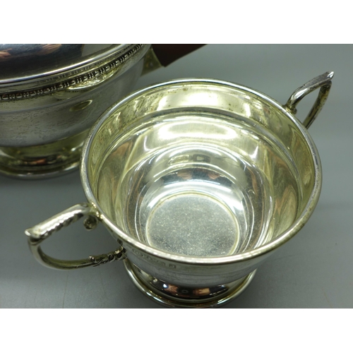 893 - A silver three piece tea service, Birmingham 1933, 614g