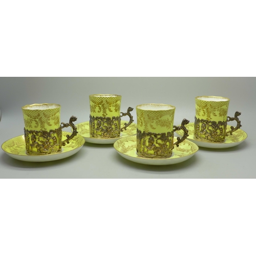 895 - Four Staffordshire 'Eggshell' coffee cans and saucers with four silver holders, William Comyns, Birm... 