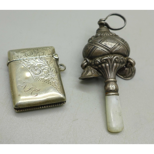 900 - A silver vesta, a/f and a silver baby's rattle, gross weight 30g