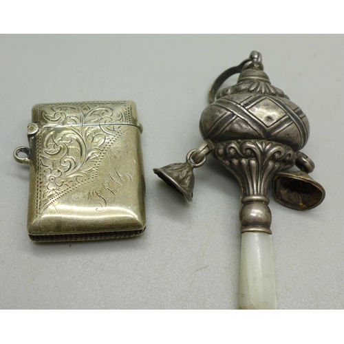 900 - A silver vesta, a/f and a silver baby's rattle, gross weight 30g