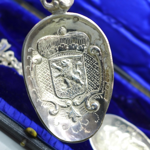 901 - A pair of silver spoons, finely decorated, with ship detail, Sheffield 1901, 145g, cased