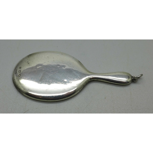 909 - A doll's miniature silver mirror, 7cm, Birmingham 1938