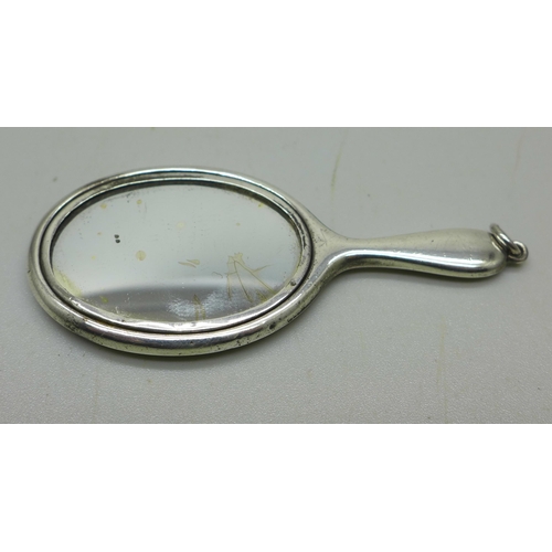 909 - A doll's miniature silver mirror, 7cm, Birmingham 1938