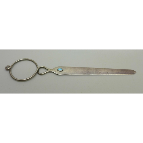 912 - A silver Arts and Crafts letter opener with turquoise set cabochon, 16.5cm, 15g