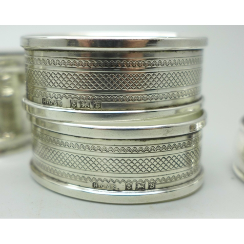 924 - Five silver napkin rings, one a/f, two others and a thimble, weight of silver 57g